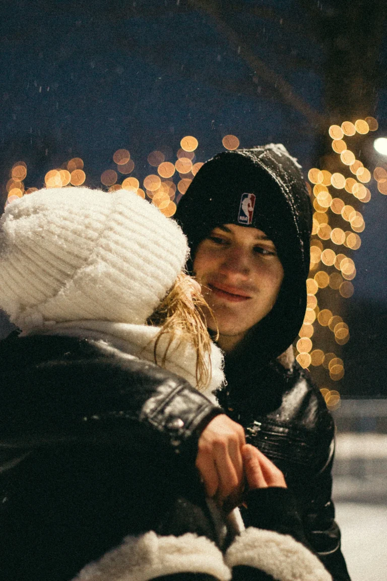 Man hugging his girlfriend at home, representing emotional connection featured in couples therapy books